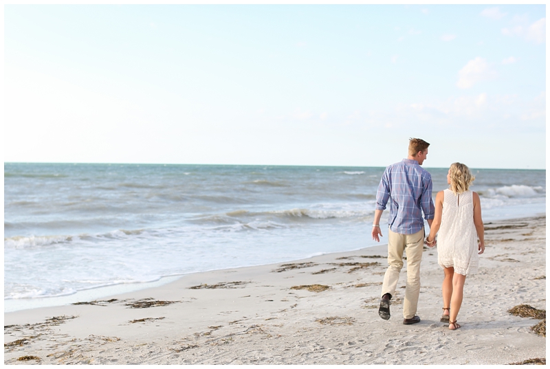 hand in hand beach engagement